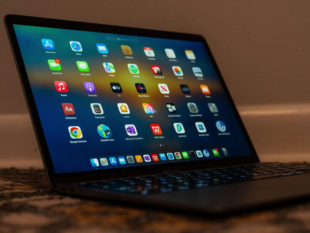 Task Manager Mac - fix frozen apps. MacBook with apps on screen.